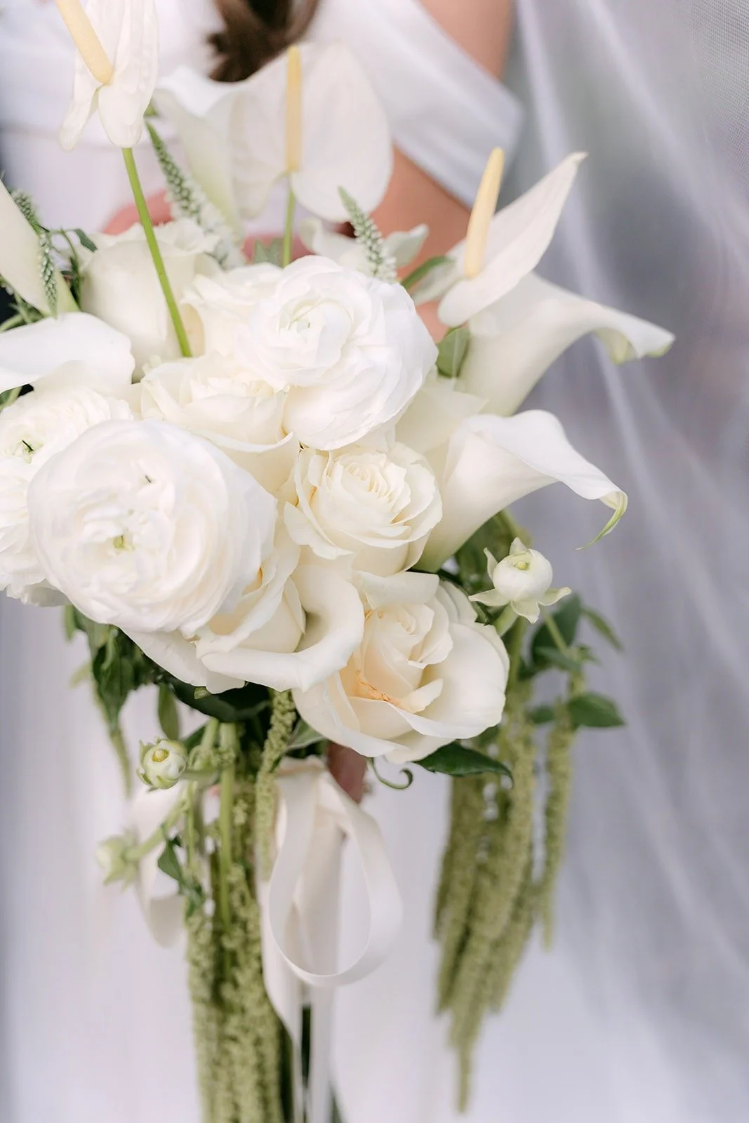 Jadee's white rose and calla lily bouquet in soft light
