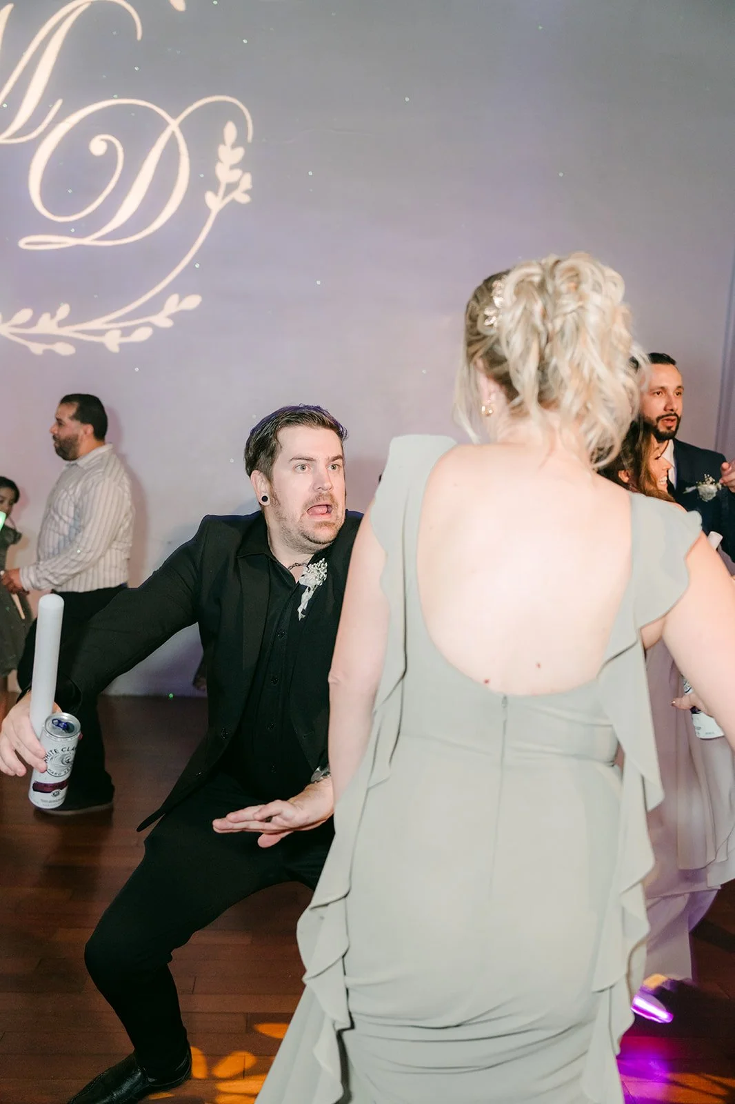 A guest dropping low on the dance floor
