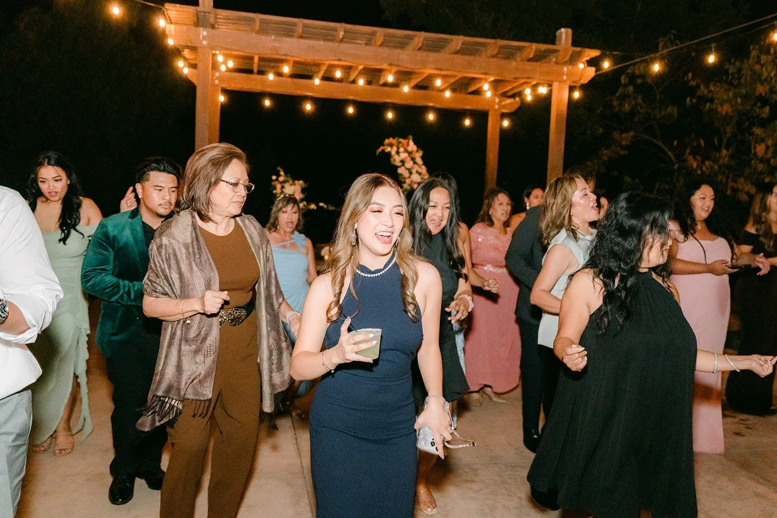 A packed dance floor under the Bel Vino pergola