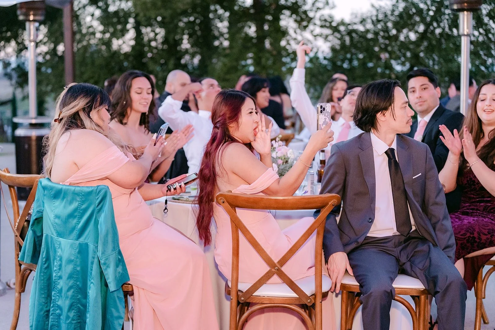 Guests cheering as Konitha and Job enter the reception