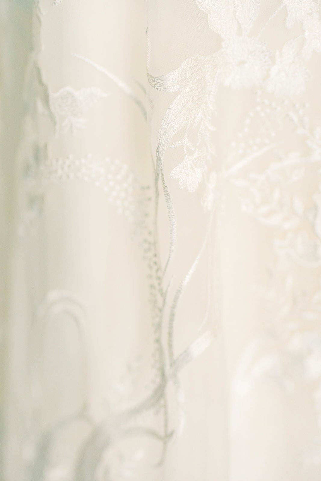 Close up of the lace and embroidery on Francesca's wedding gown