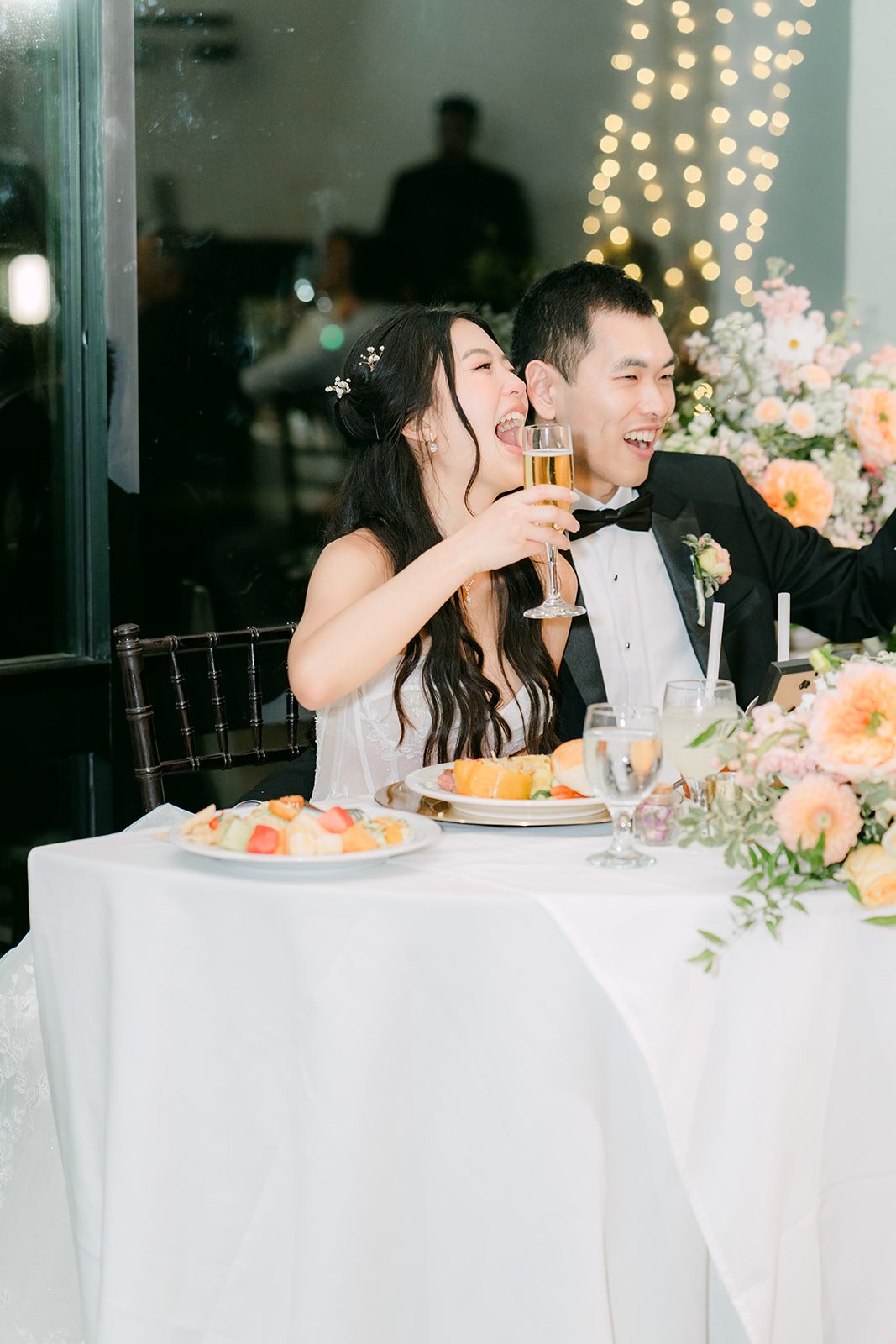 Clarissa and Austin laughing during the speeches