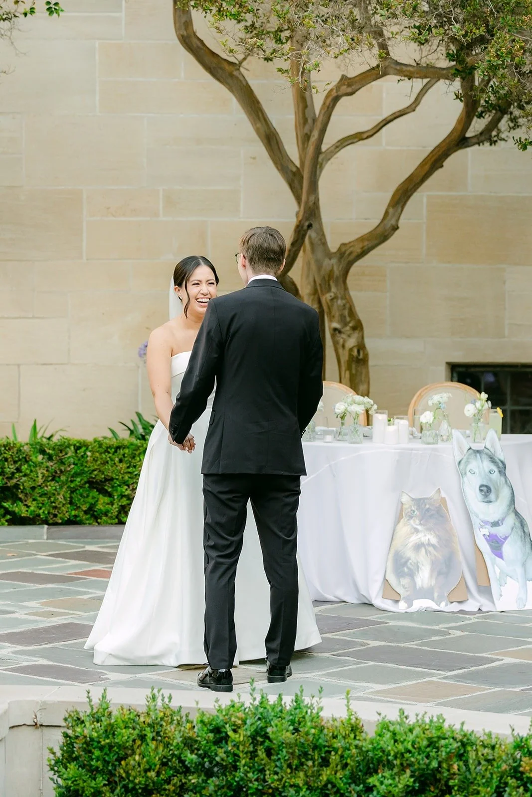 Brianna and Nik swaying beside their sweetheart table