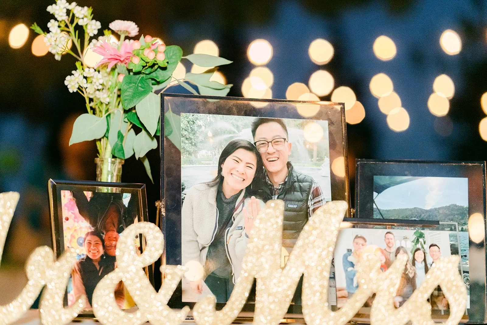 Mr and Mrs sign beside a framed photo of Xuemin and Alex