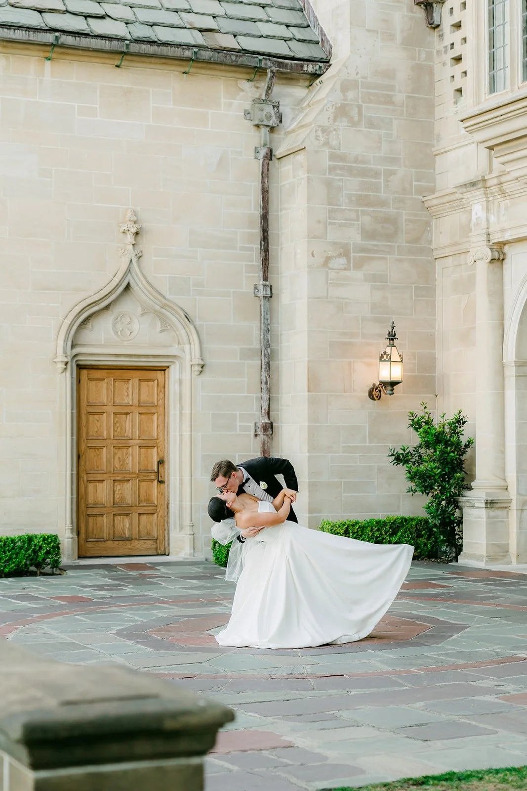 Nik dipping Brianna in front of the Greystone Mansion entrance, photographed by One and Only Production