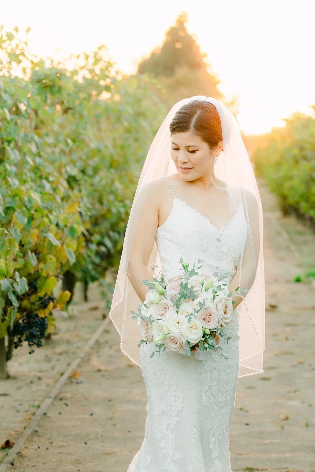 Xuemin with her bouquet and veil at sunset