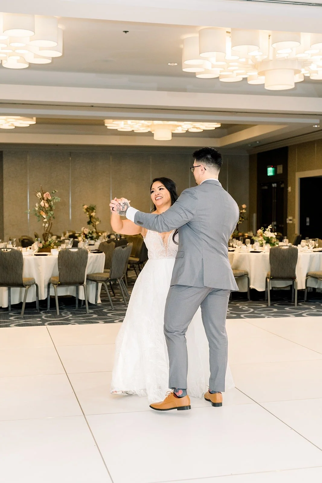 Betsy and Mikey begin their first dance in the Beacon Ballroom