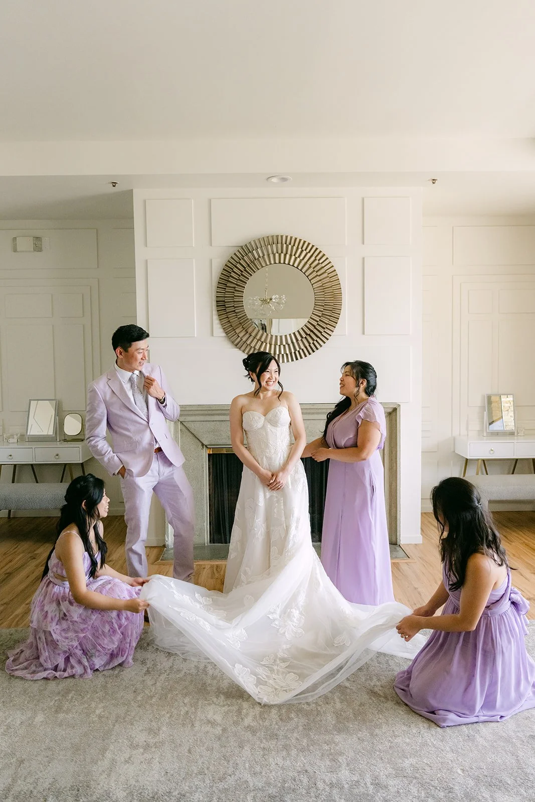 Mary's bridal party admiring her gown