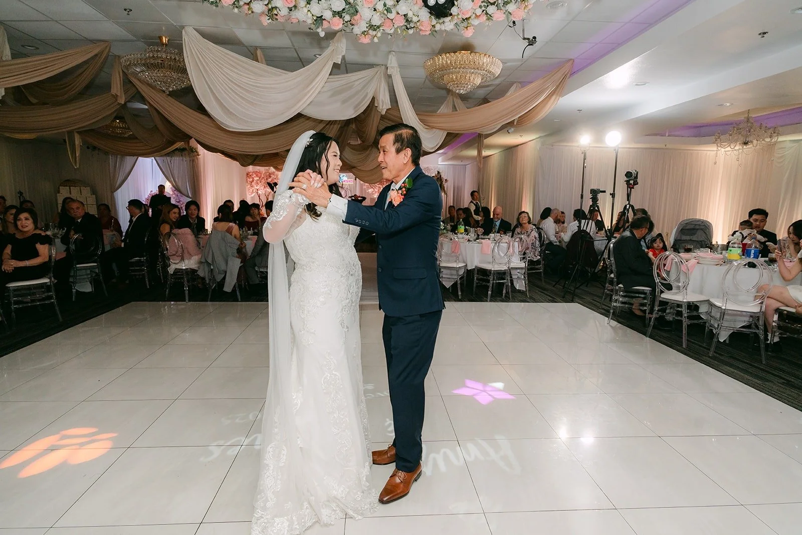A parent dance on the open white floor at Diamond Seafood Palace