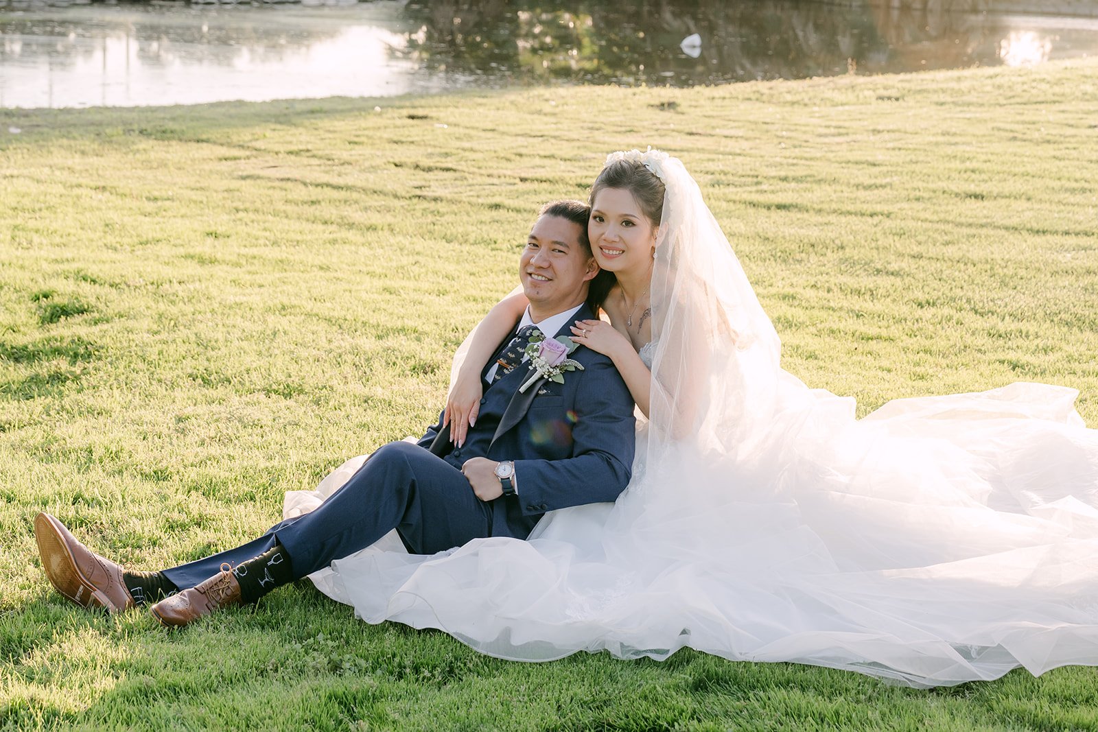 Kate and Michael relaxing together on the grass.