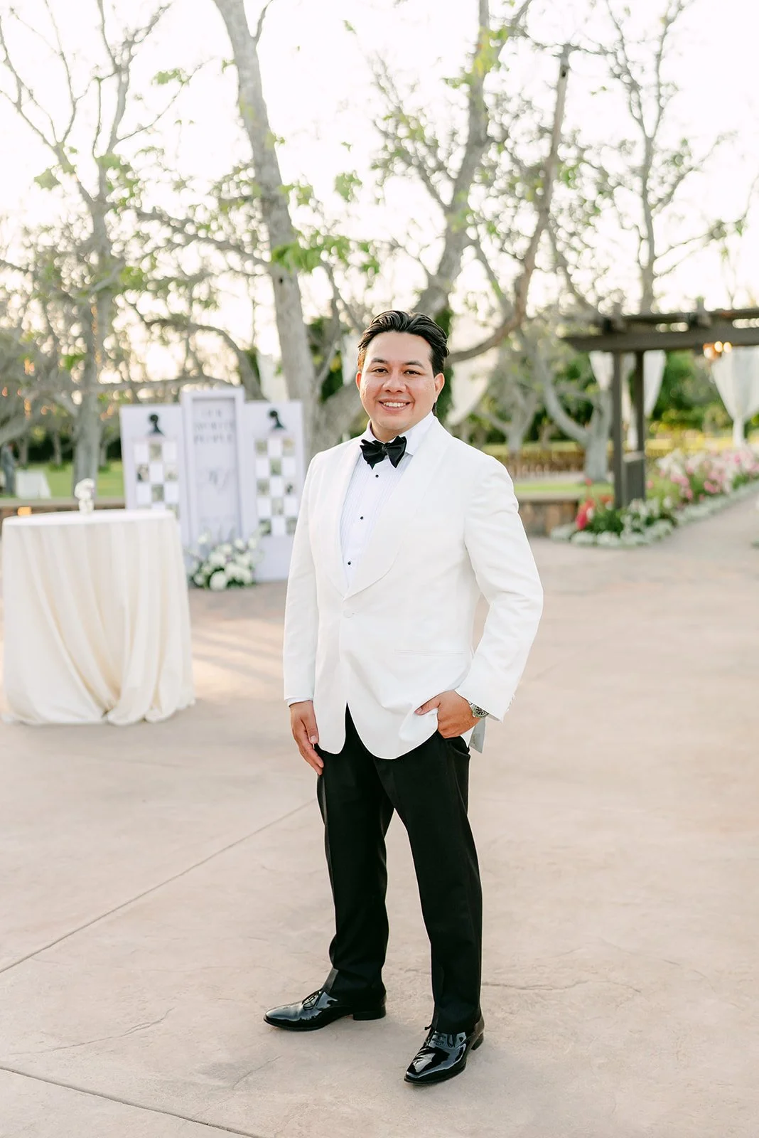 Groom in a white dinner jacket at The Walnut Grove