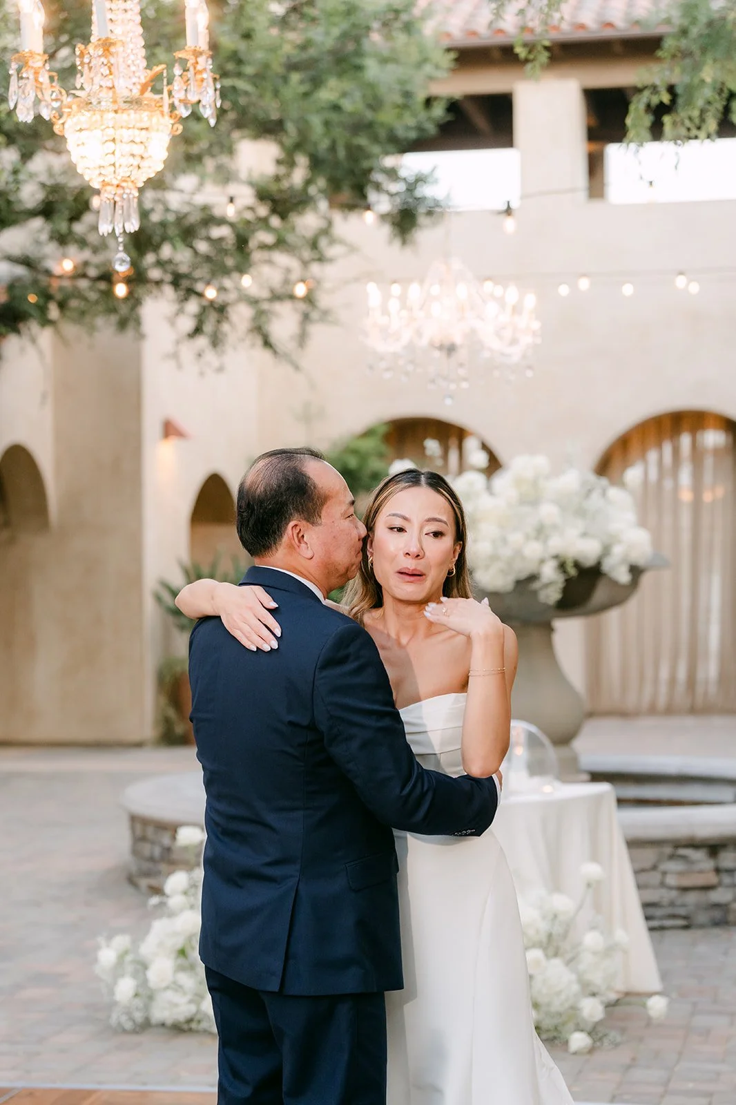 Father daughter dance beside the fountain