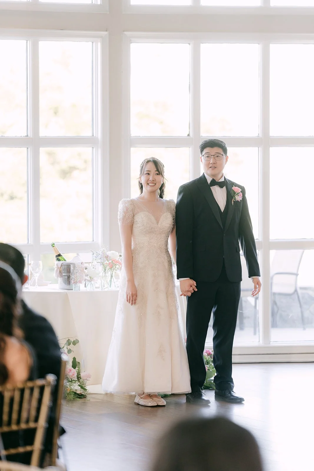 Judy and Joshua entering the reception