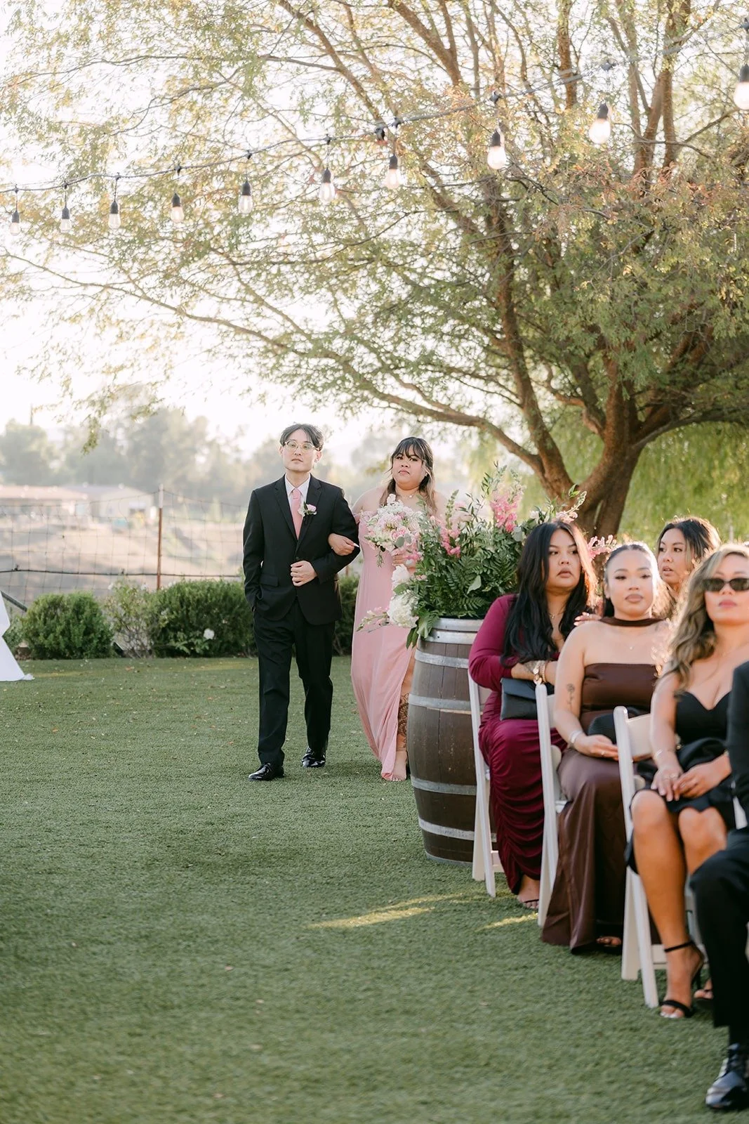 Bridesmaids and groomsmen walking down the aisle