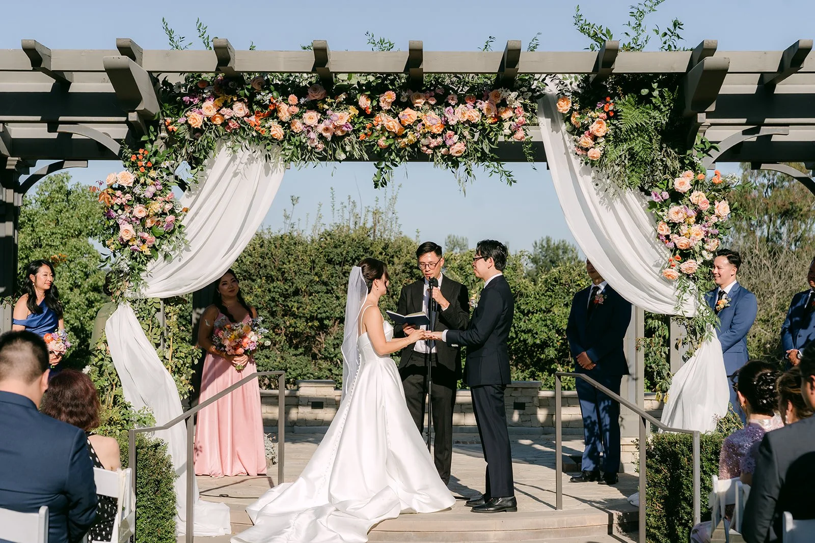 A wide view of the ceremony arch at South Coast Botanic Garden