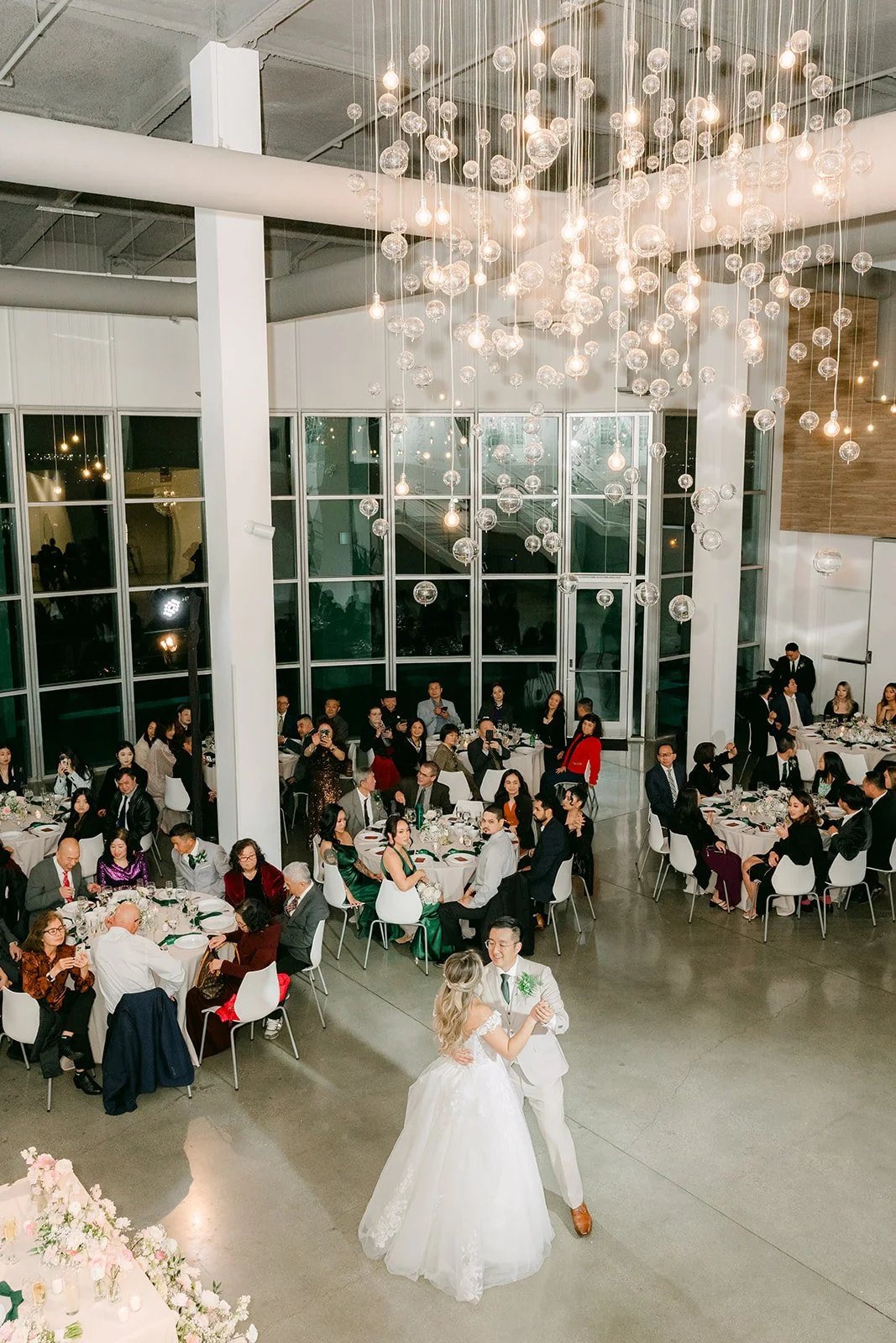 Overhead view of the first dance under The Modern's chandeliers