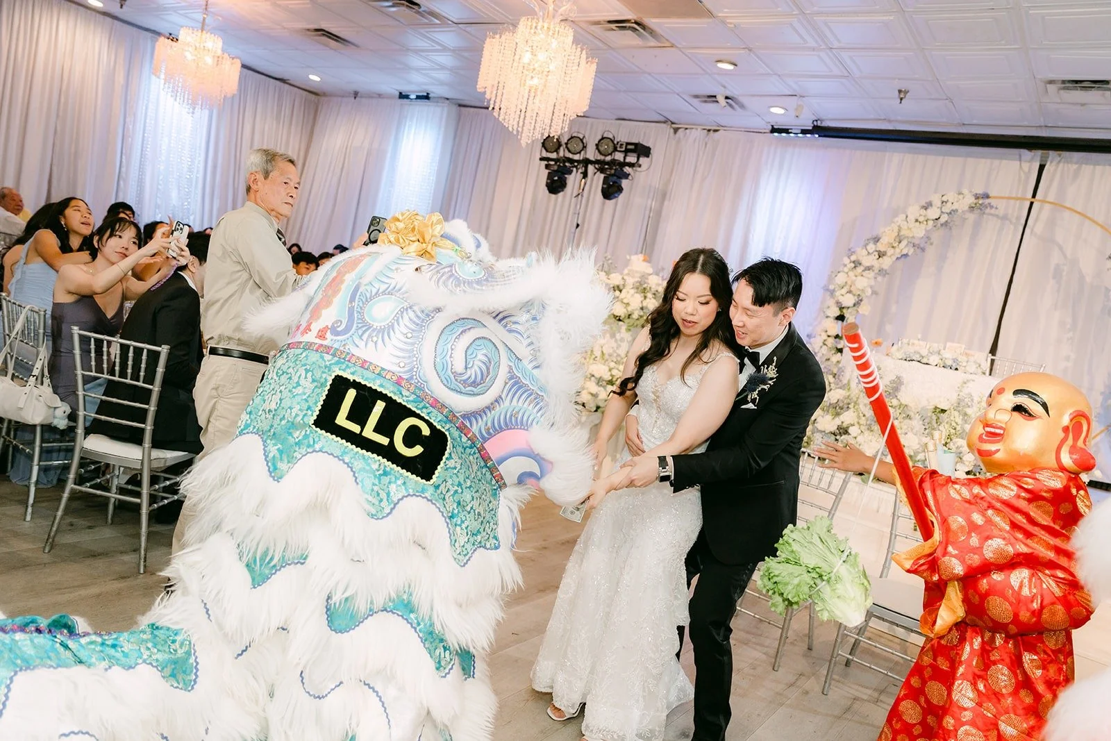 Lions performing for Emily and James at the front of the room