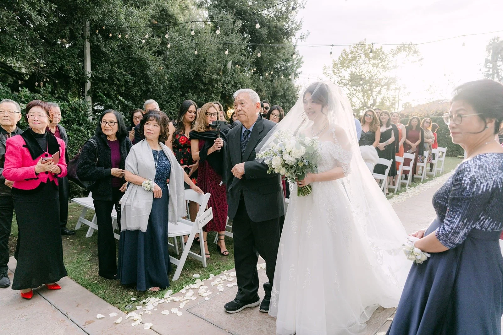 Sochi walks down the aisle with a family member
