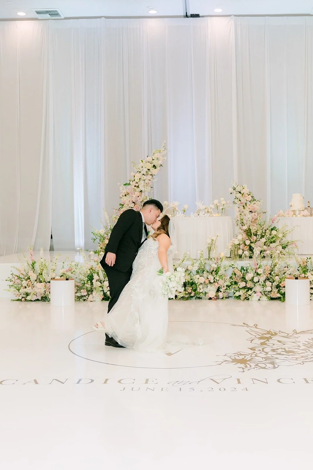 Candice and Vincent laughing on the dance floor, photographed by One and Only Production