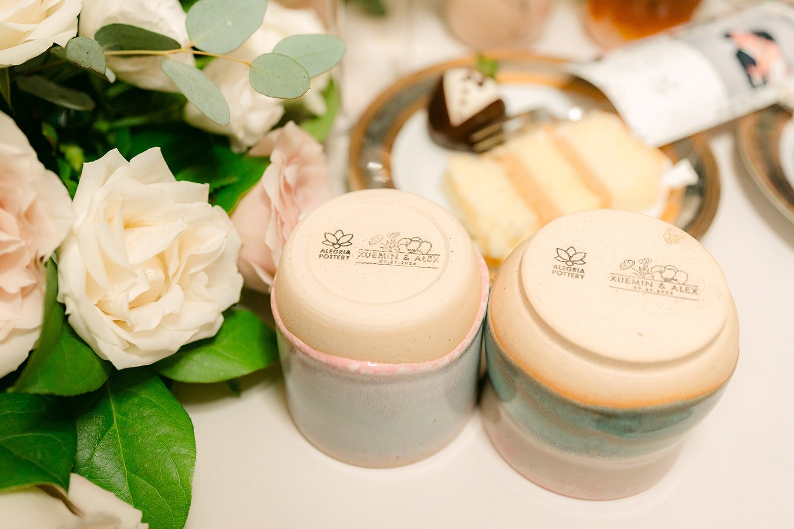 Wedding favors in small tins with white roses, photographed by One and Only Production