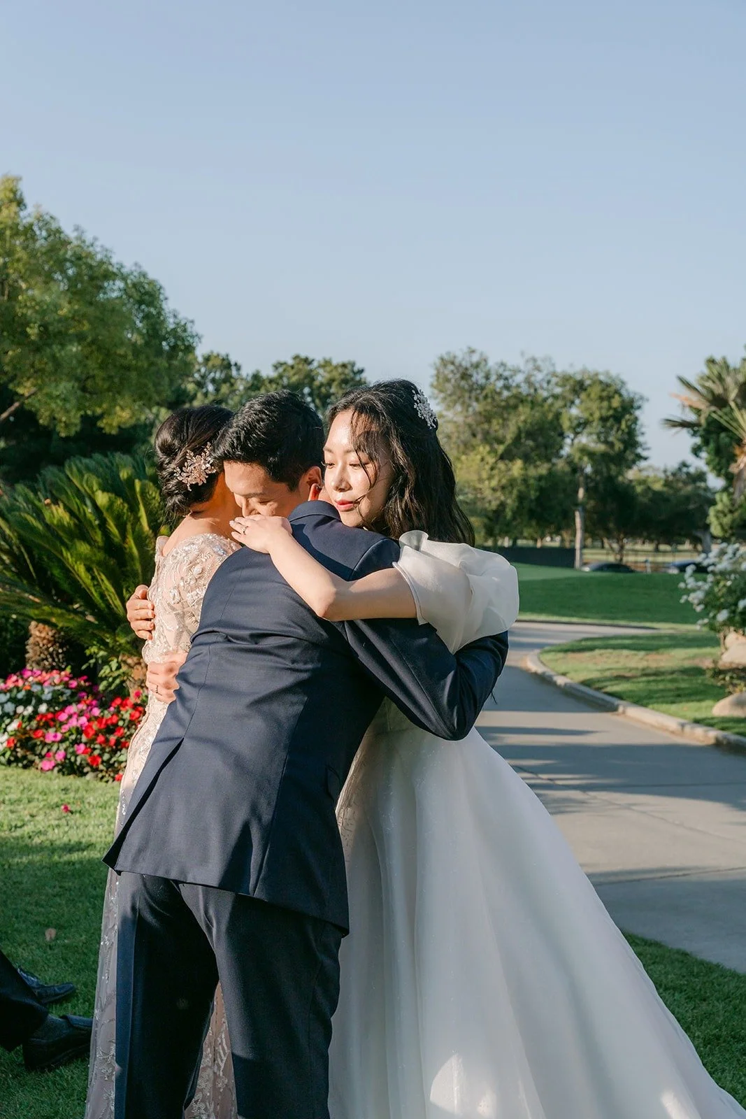 Jeannie sharing a hug with a family member after the ceremony