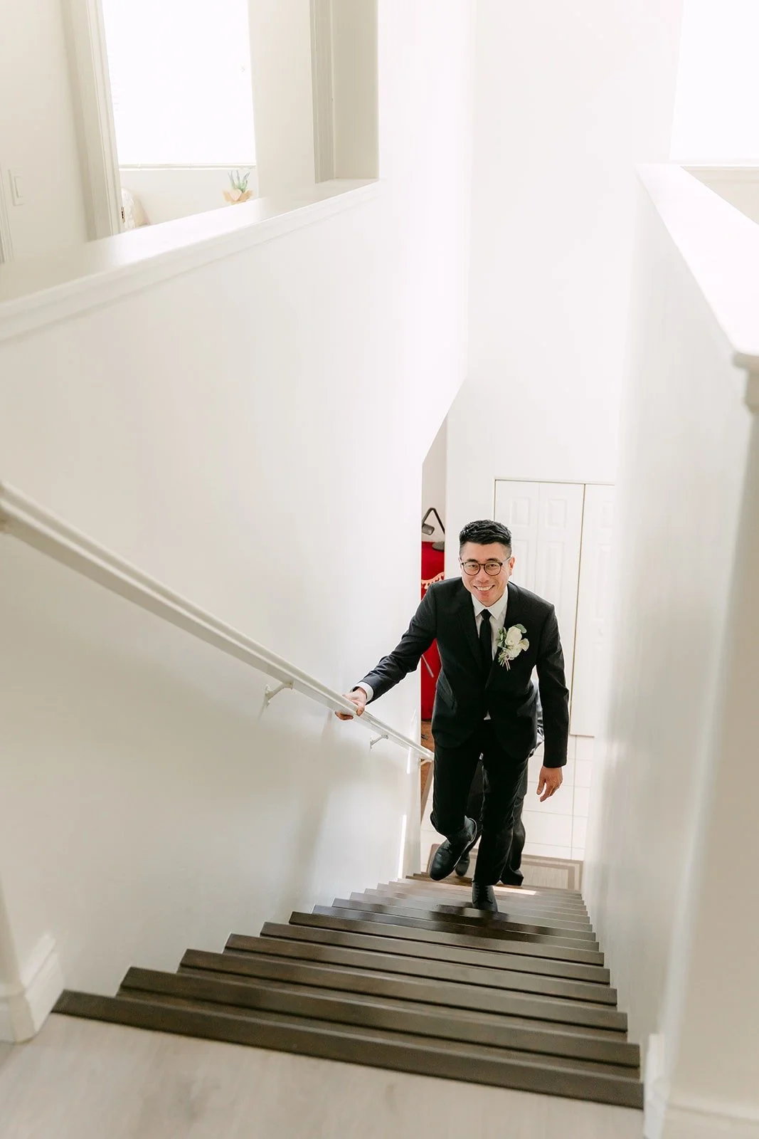 Eric climbs the stairs to pick up Eunice from her room, photographed by One and Only Production