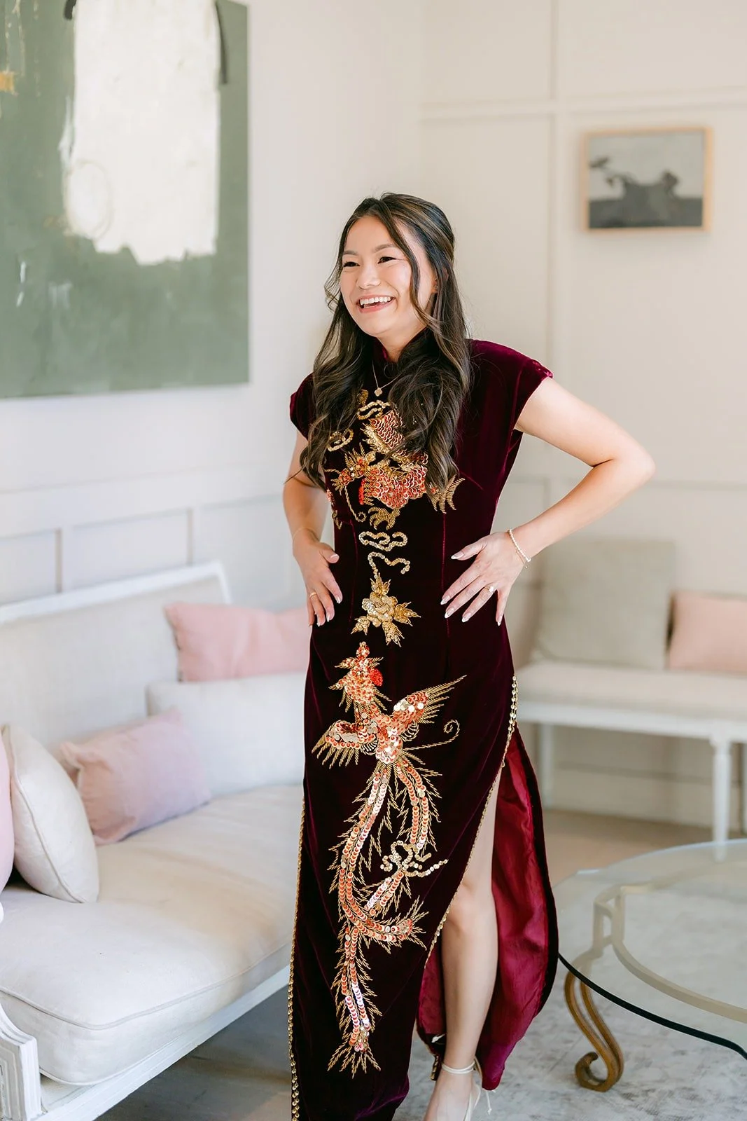Jadee in her burgundy and gold qipao in the bridal suite at The Harper