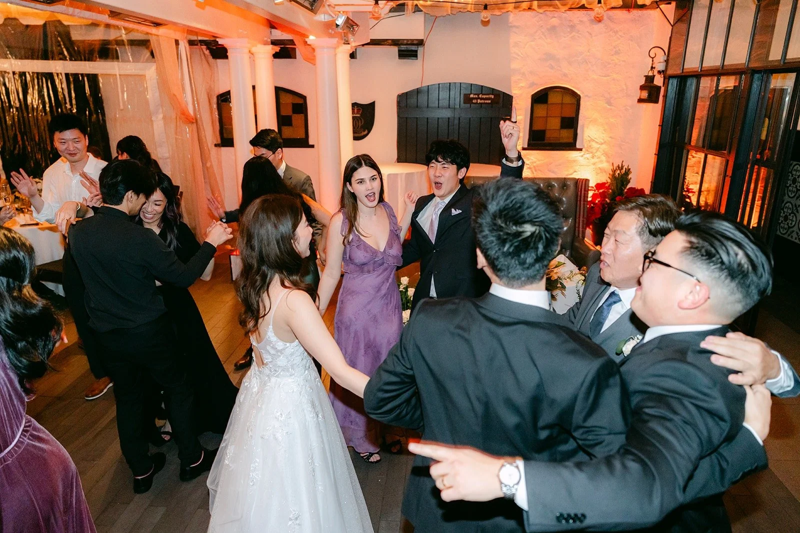 Guests crowding the dance floor around Valerie