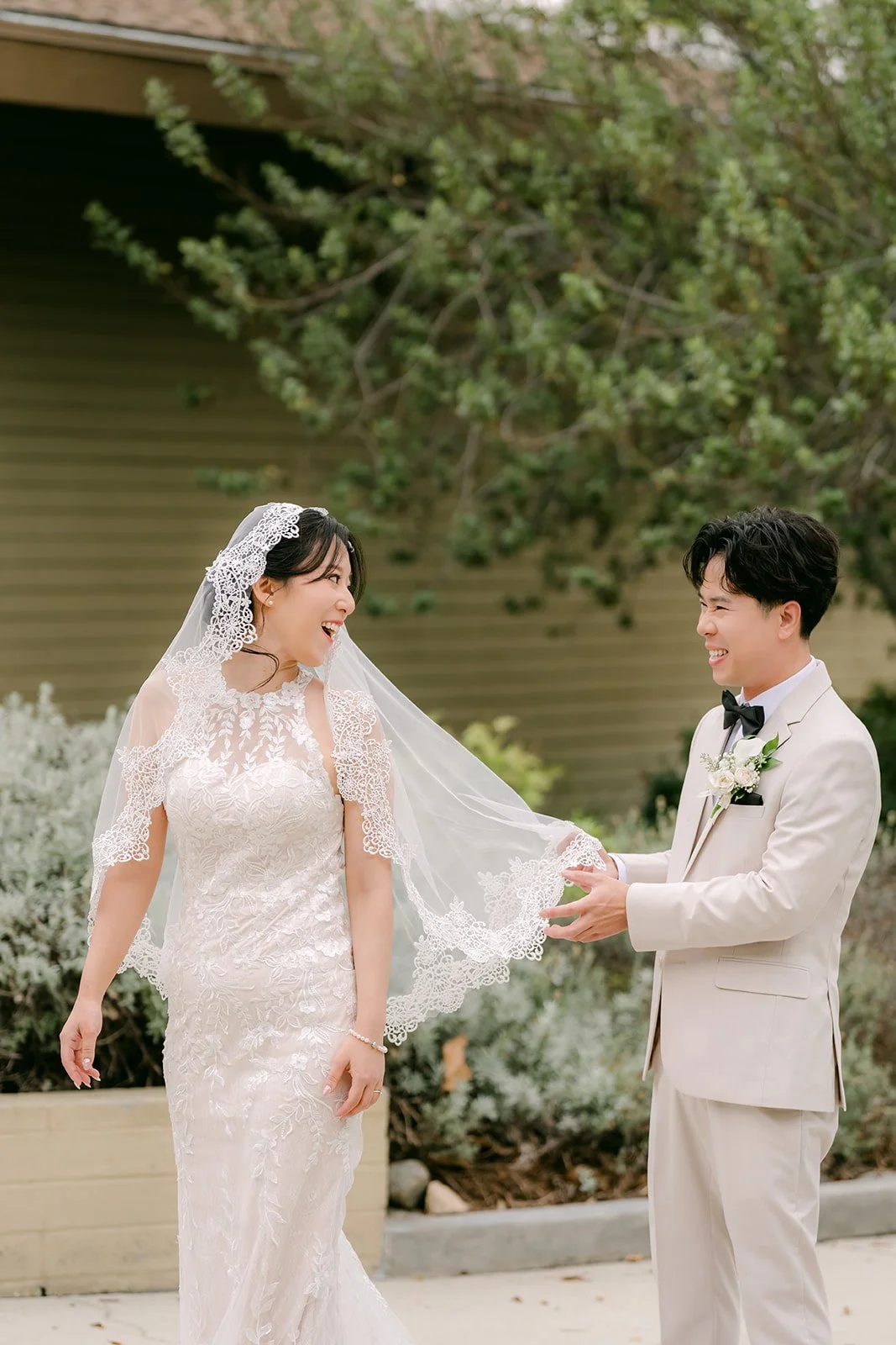 Elaine twirling her veil beside Wen.