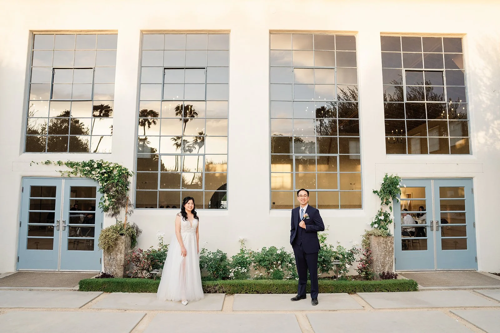 Constance and Lawrence in front of the tall windows at Grand Gimeno