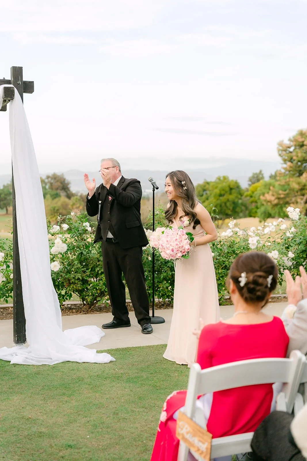 Guests watching the ceremony on the lawn