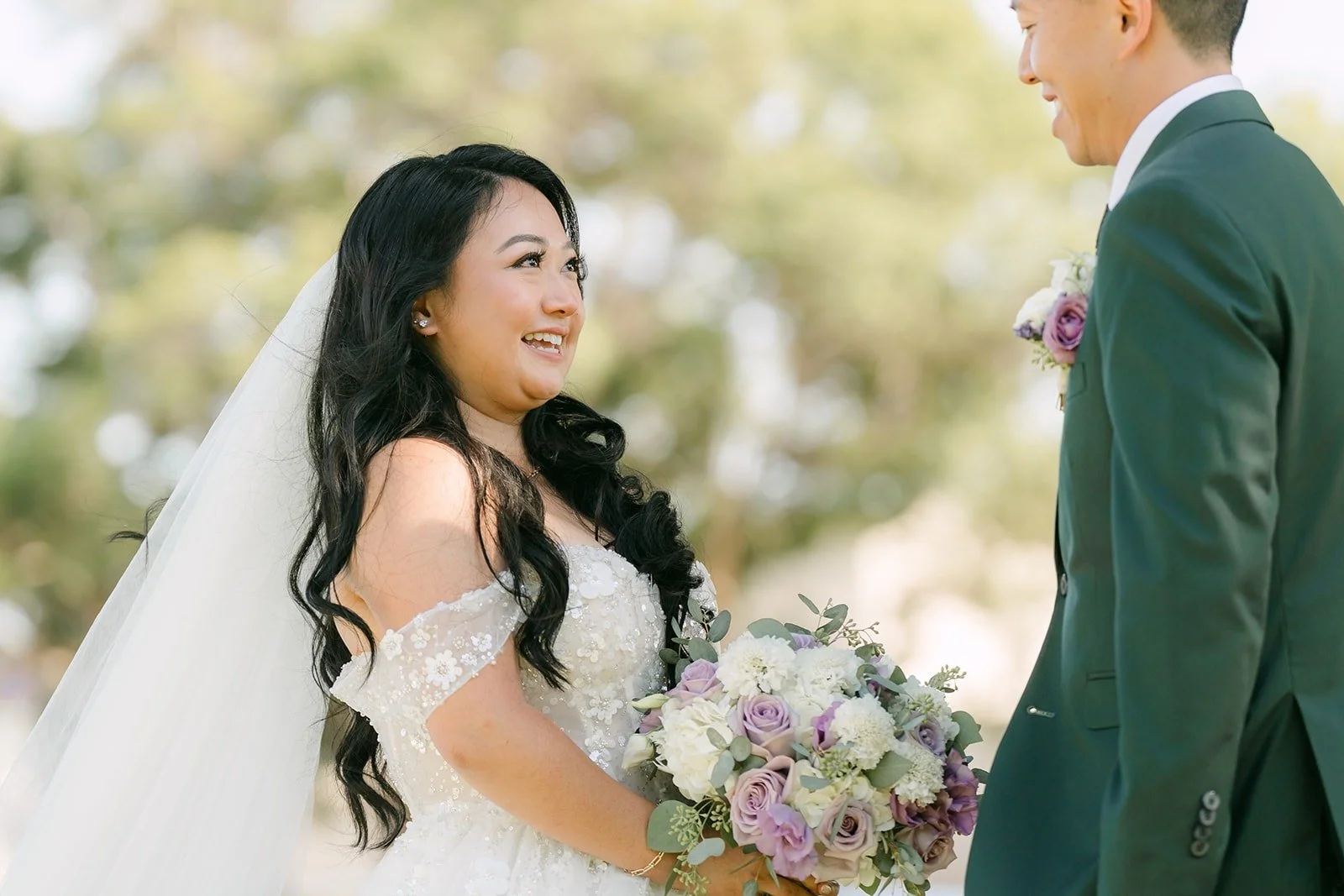 Jennifer smiles at Kevin as he takes in her gown