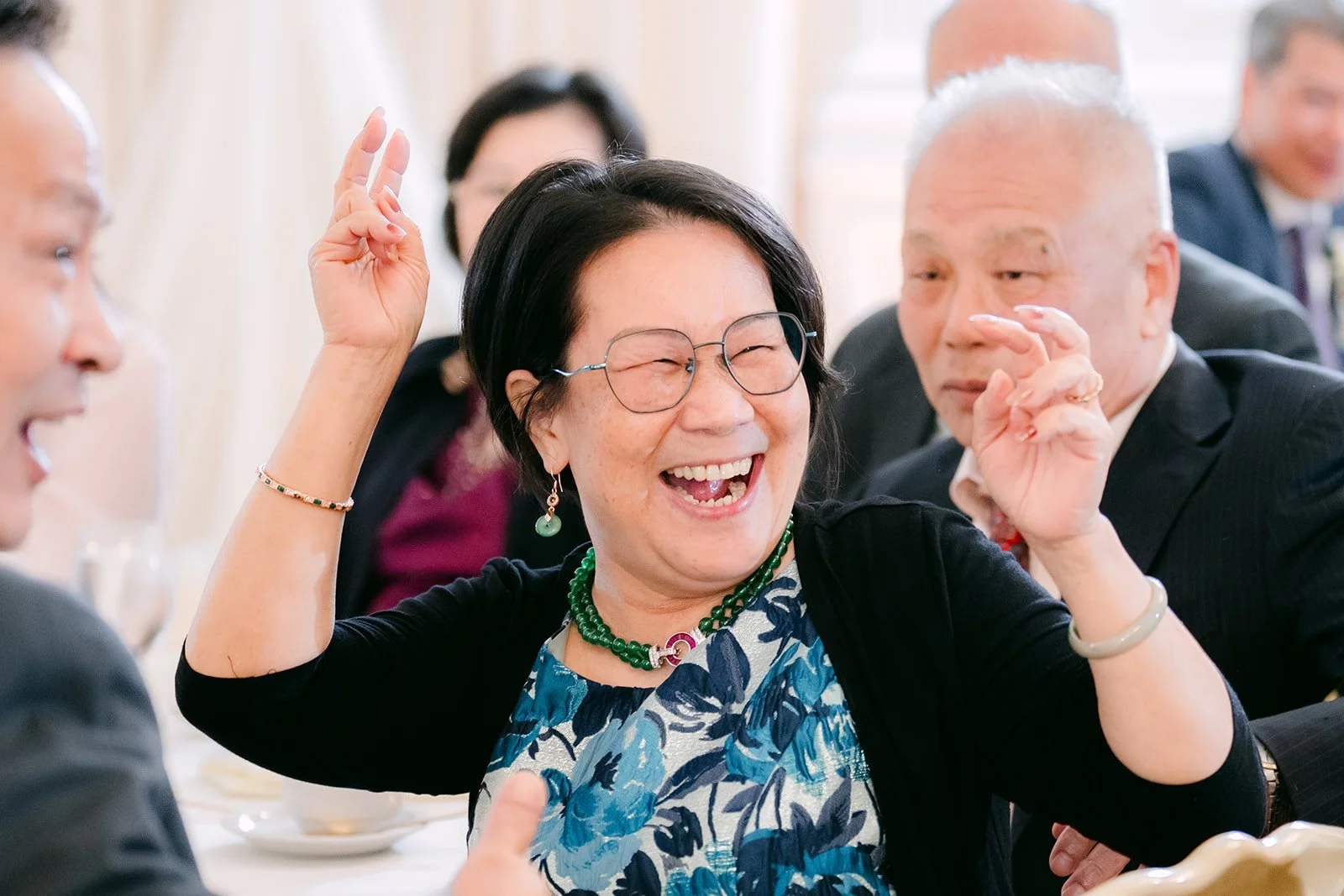 A guest laughing at the reception.