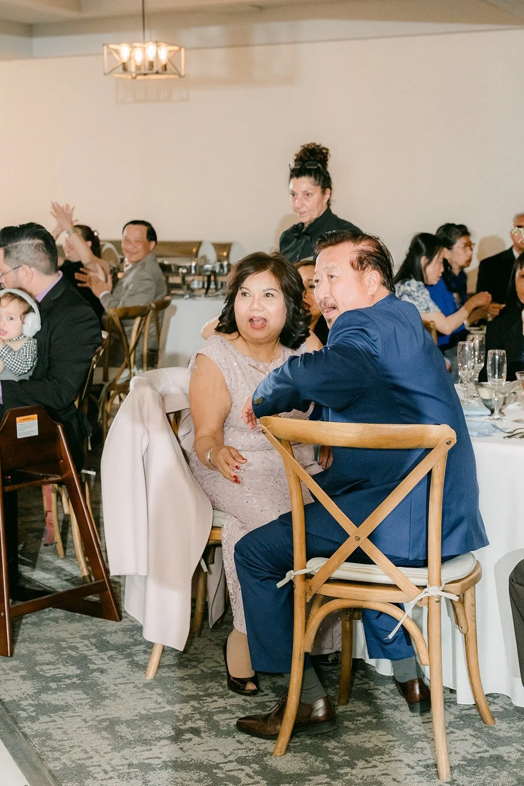 Guests cheering from their tables