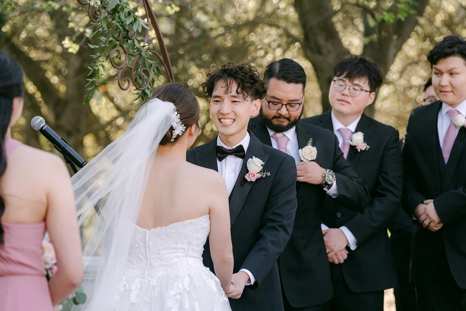 Tony and his groomsmen reacting as the bride arrives at the altar