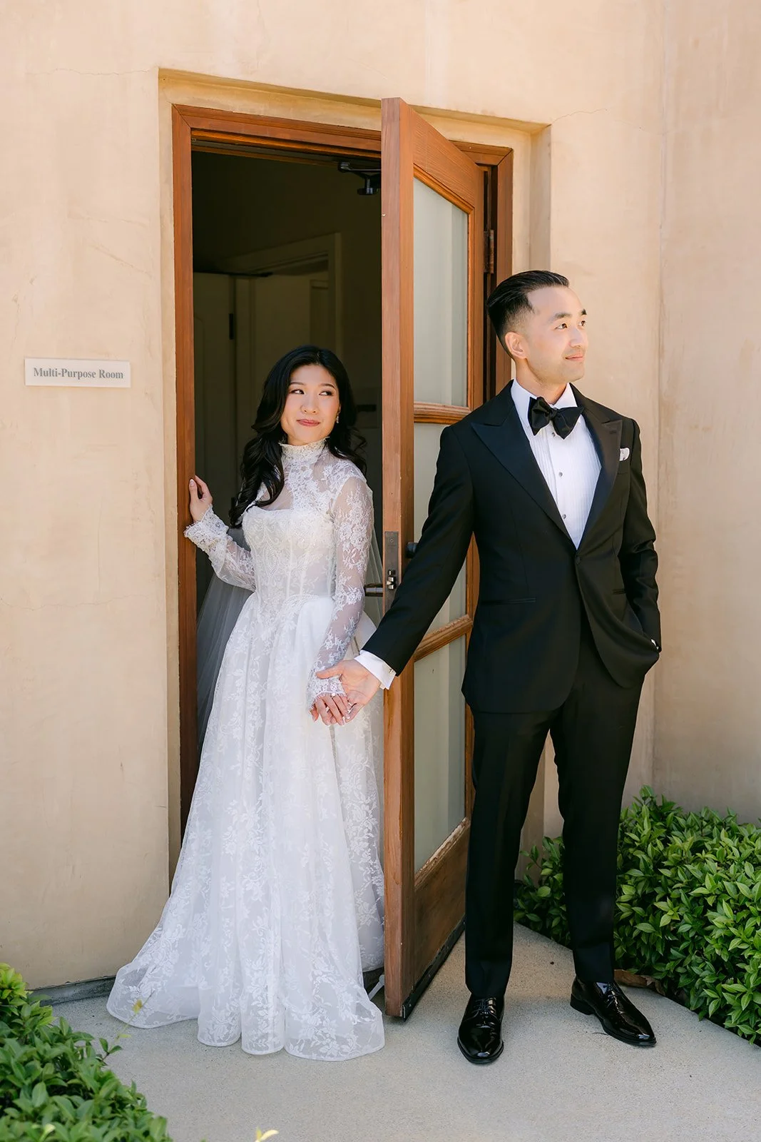 Kim and Vincent on either side of the open door