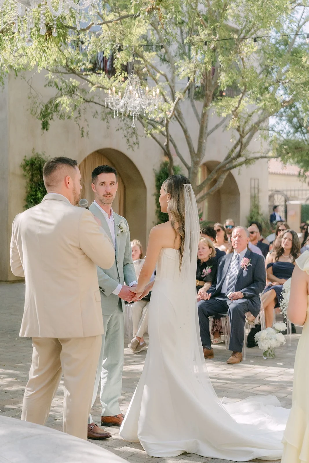 Kieu arriving at the end of the courtyard aisle