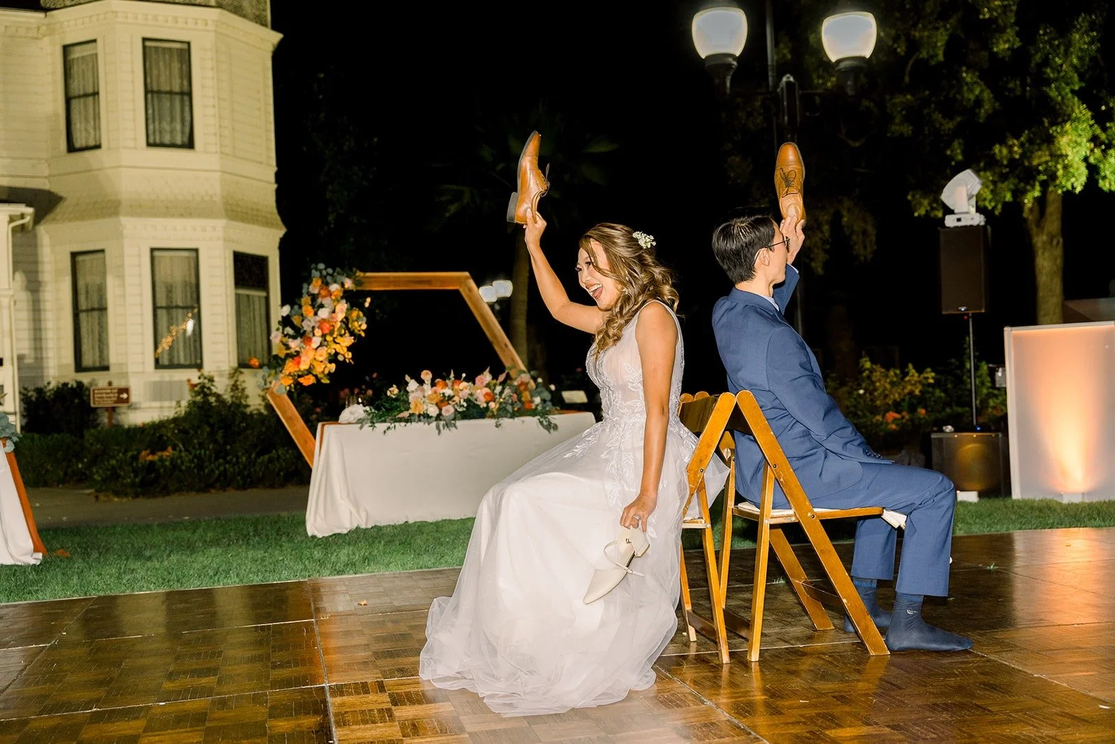 Ariel and Alex seated back to back for a reception game