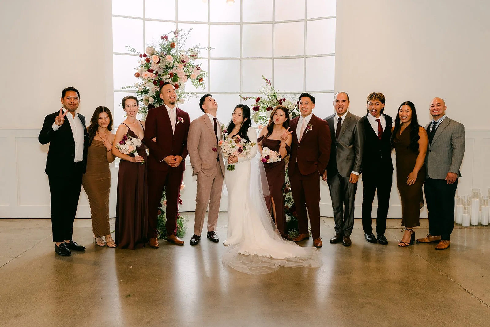 Denise and Michael with family in the ballroom, photographed by One and Only Production.