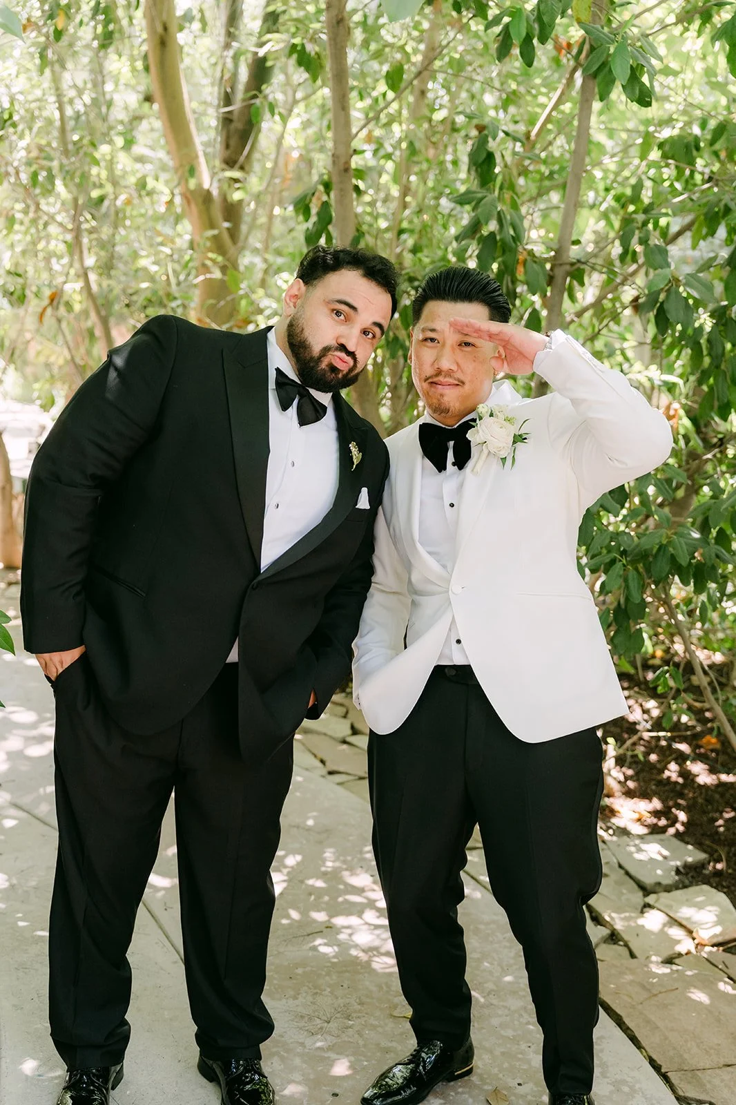 Caryl and a groomsman goofing around in the garden before the ceremony.