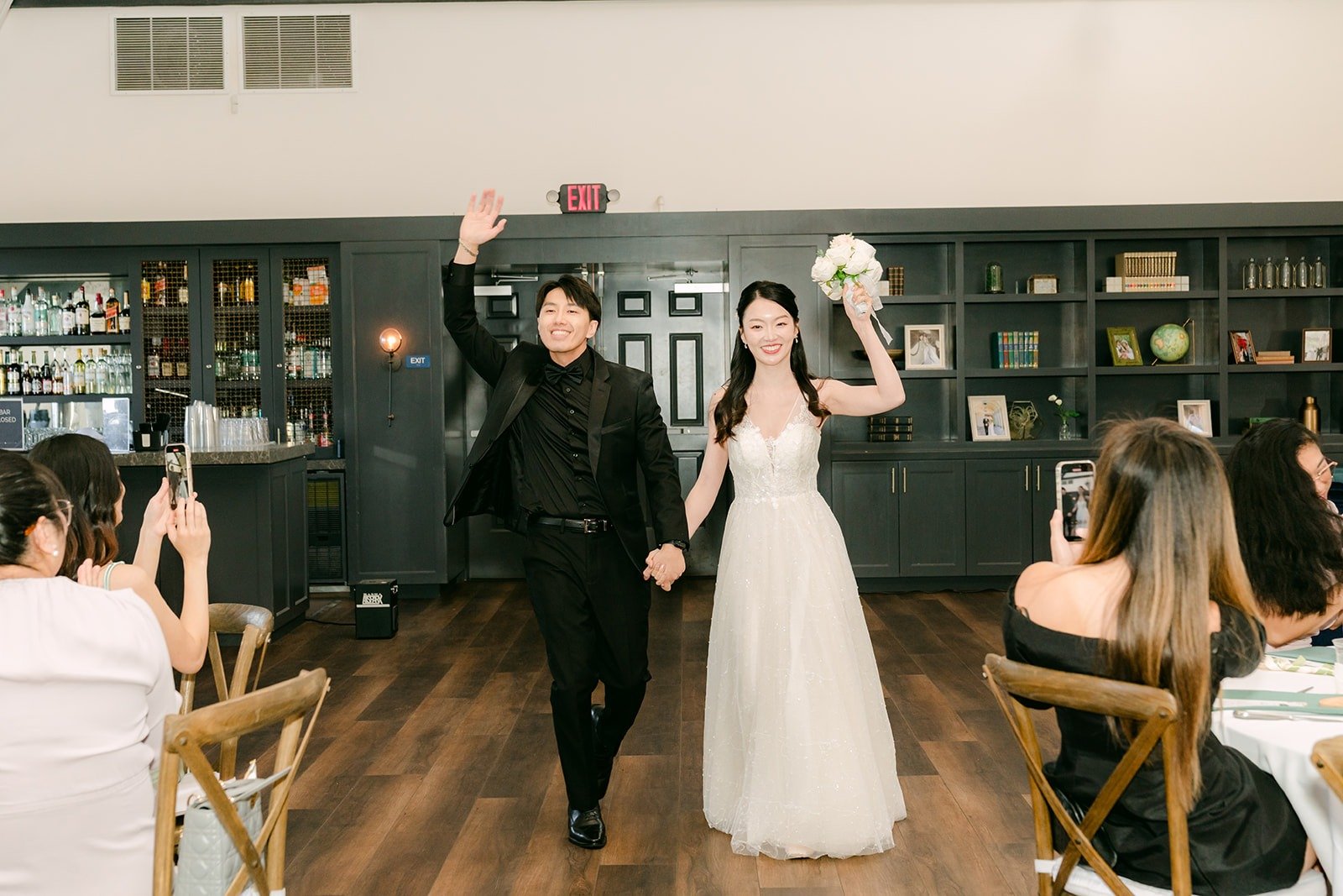 Fong lifting his arm in celebration during the grand entrance