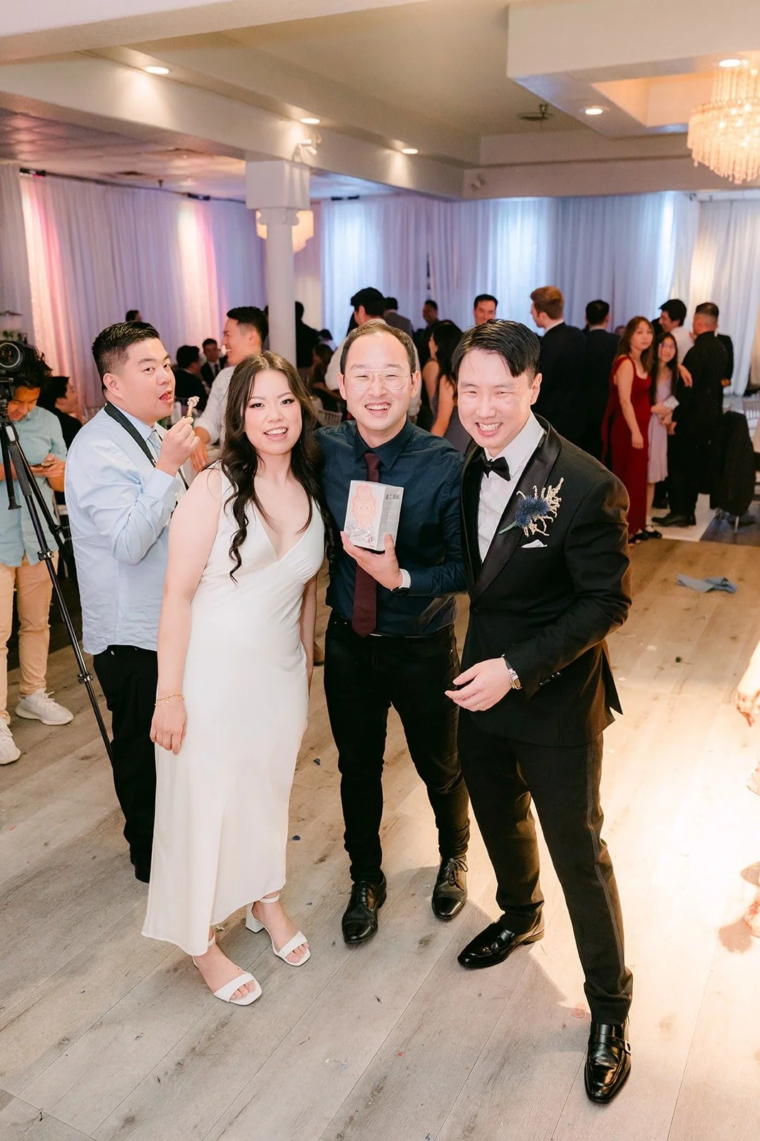 The Labubu winner posing with Emily and James