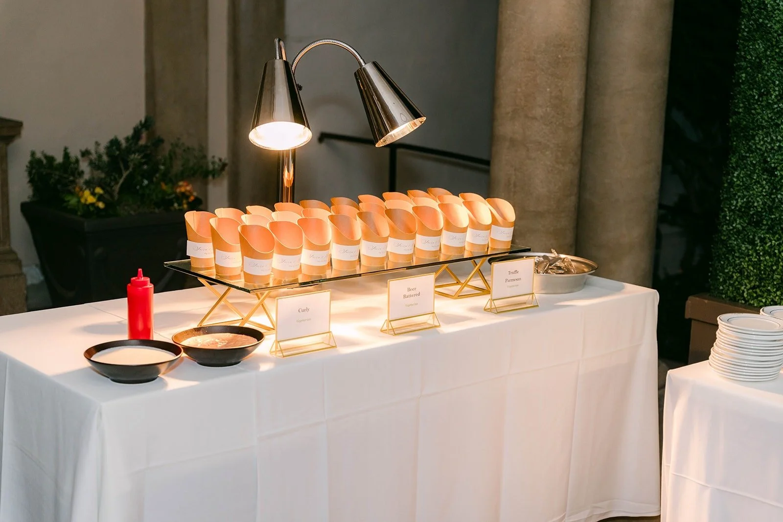 A buffet set beneath warming lamps