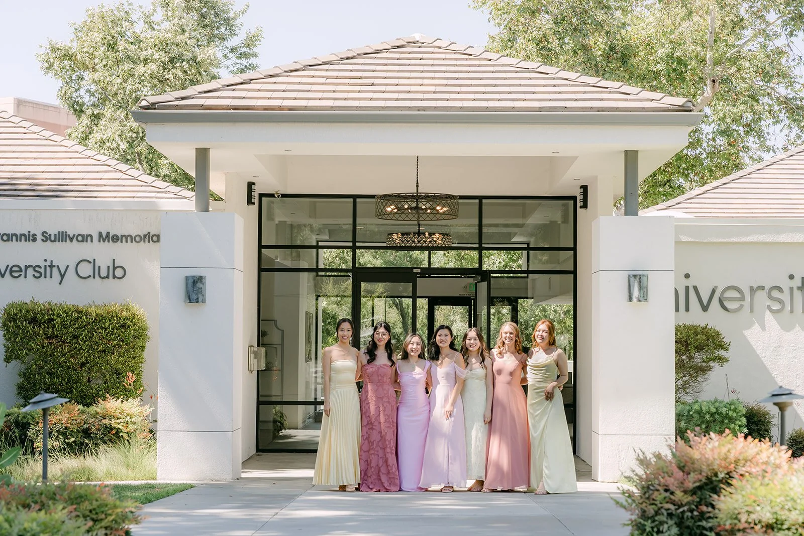 Clarissa and her bridesmaids at the entrance of the University Club
