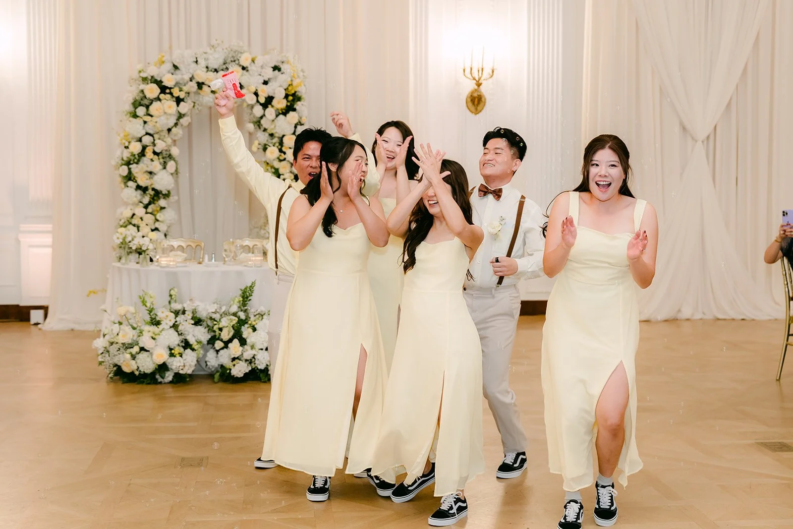 Bridesmaids dancing in for the grand entrance.