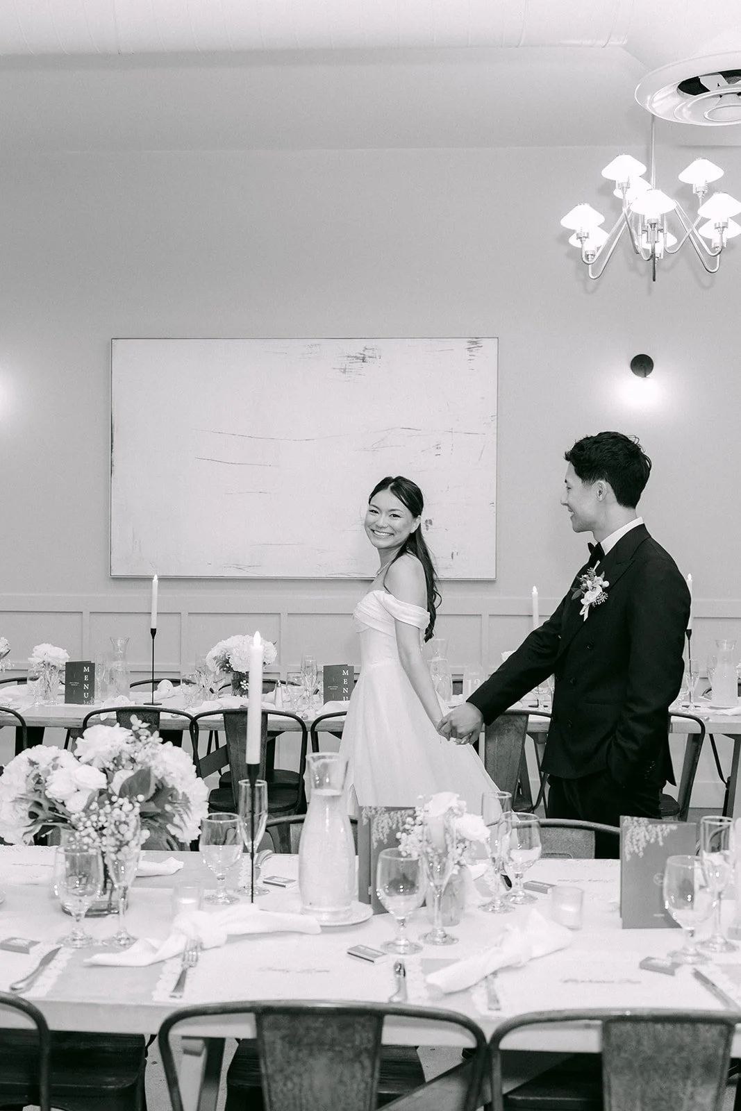 Black and white photo of the couple in the reception room