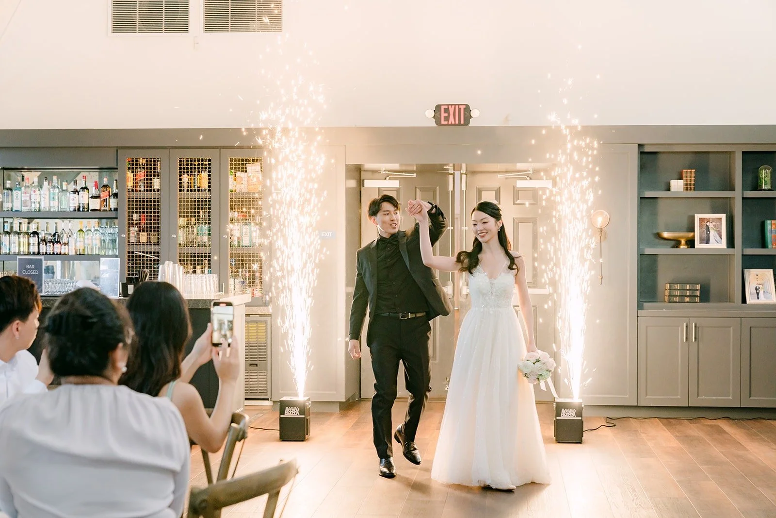 Tin and Fong walking into the ballroom