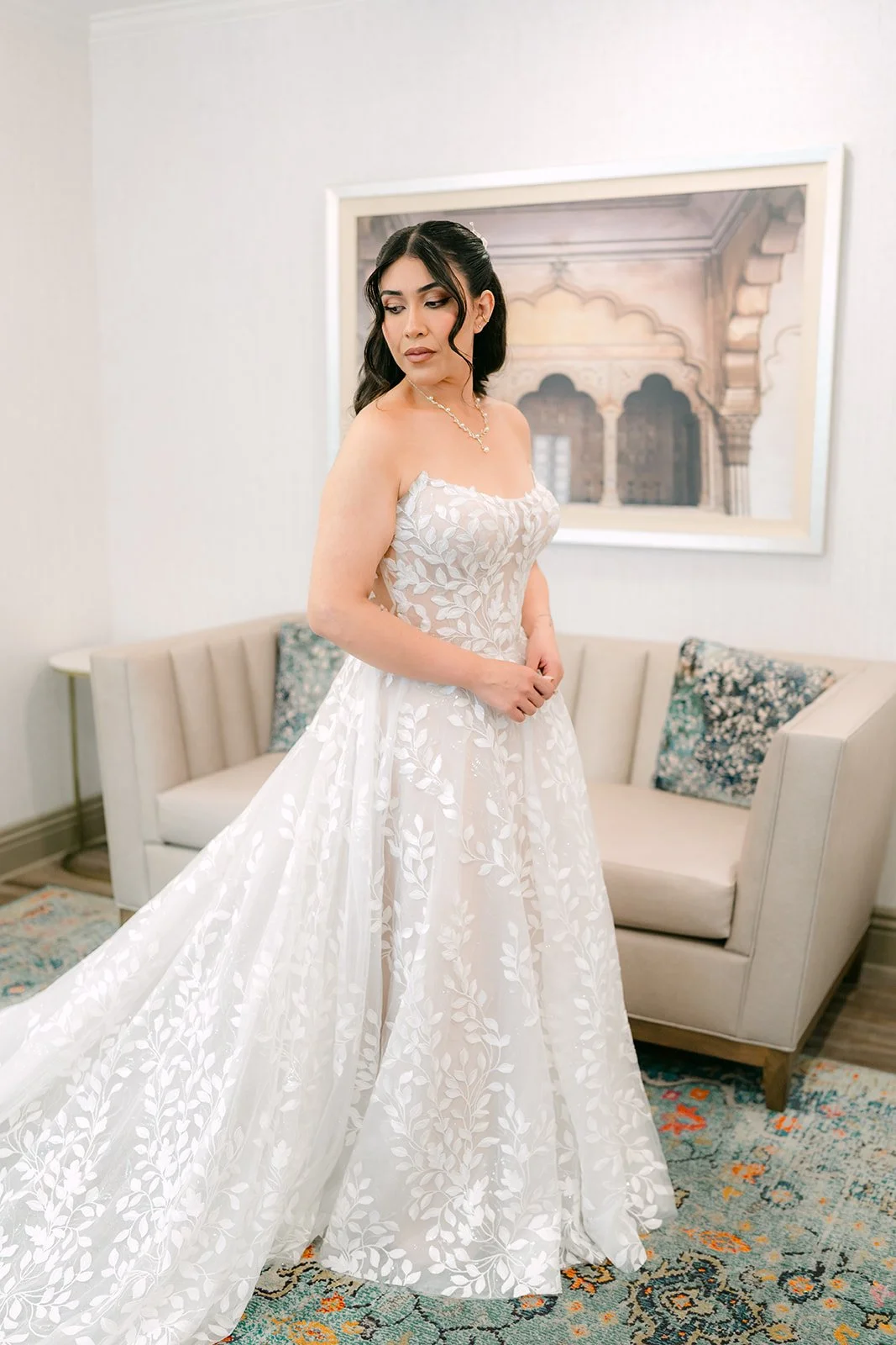 Fernanda in her lace gown in the hotel suite.
