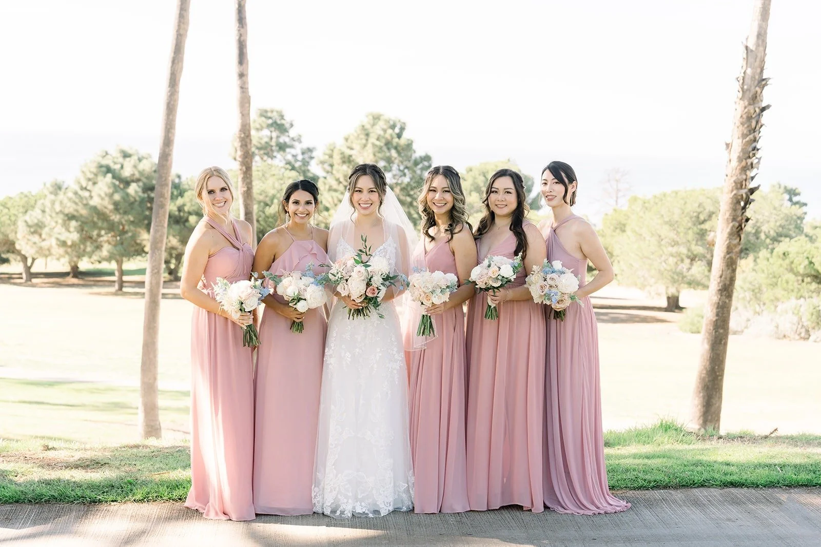 Josephine surrounded by her bridesmaids in pink