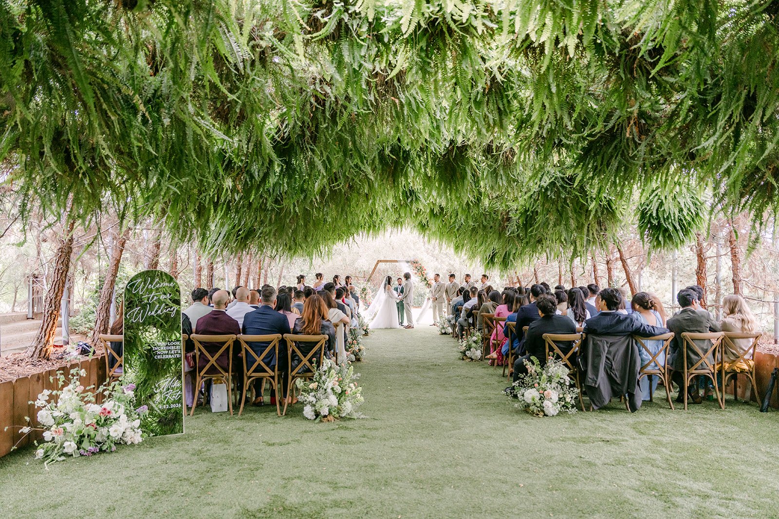 Guests seated under the ferns in the Woodland Grotto